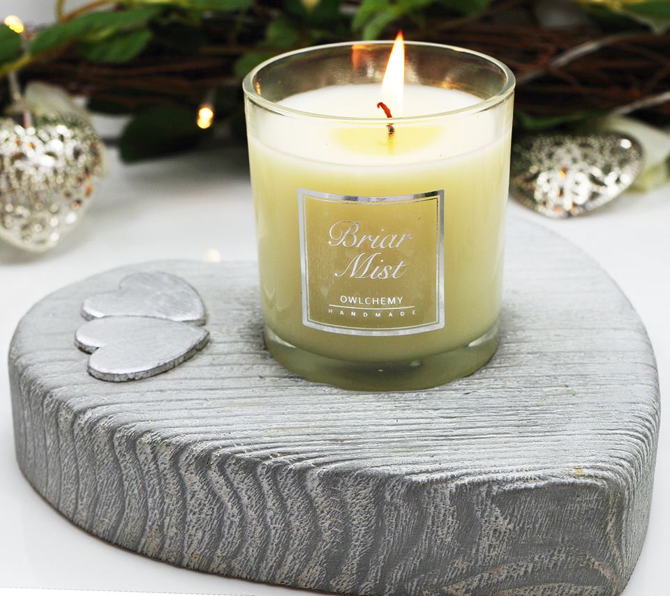 Our Briar Mist candle in a silver candle holder 