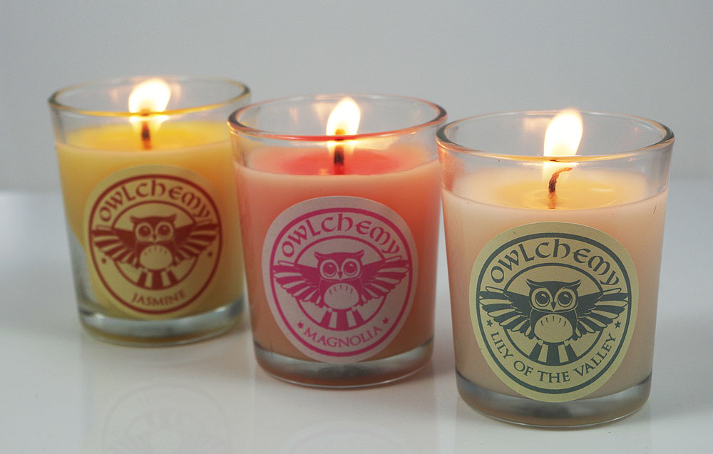 Our luxury set of three summer-scented candles lit on a summer’s evening.